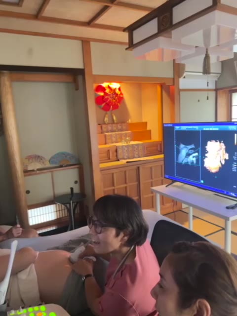 Family and friends together during an ultrasound session